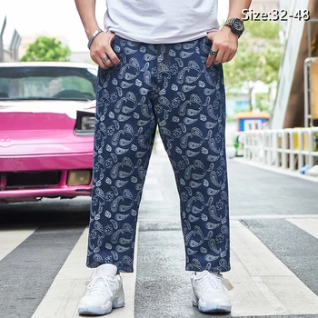 Marca plus size homens soltos harém reta perna calças de nove pontos jeans larga mão casual high street hip-hop moda calças de jacquard